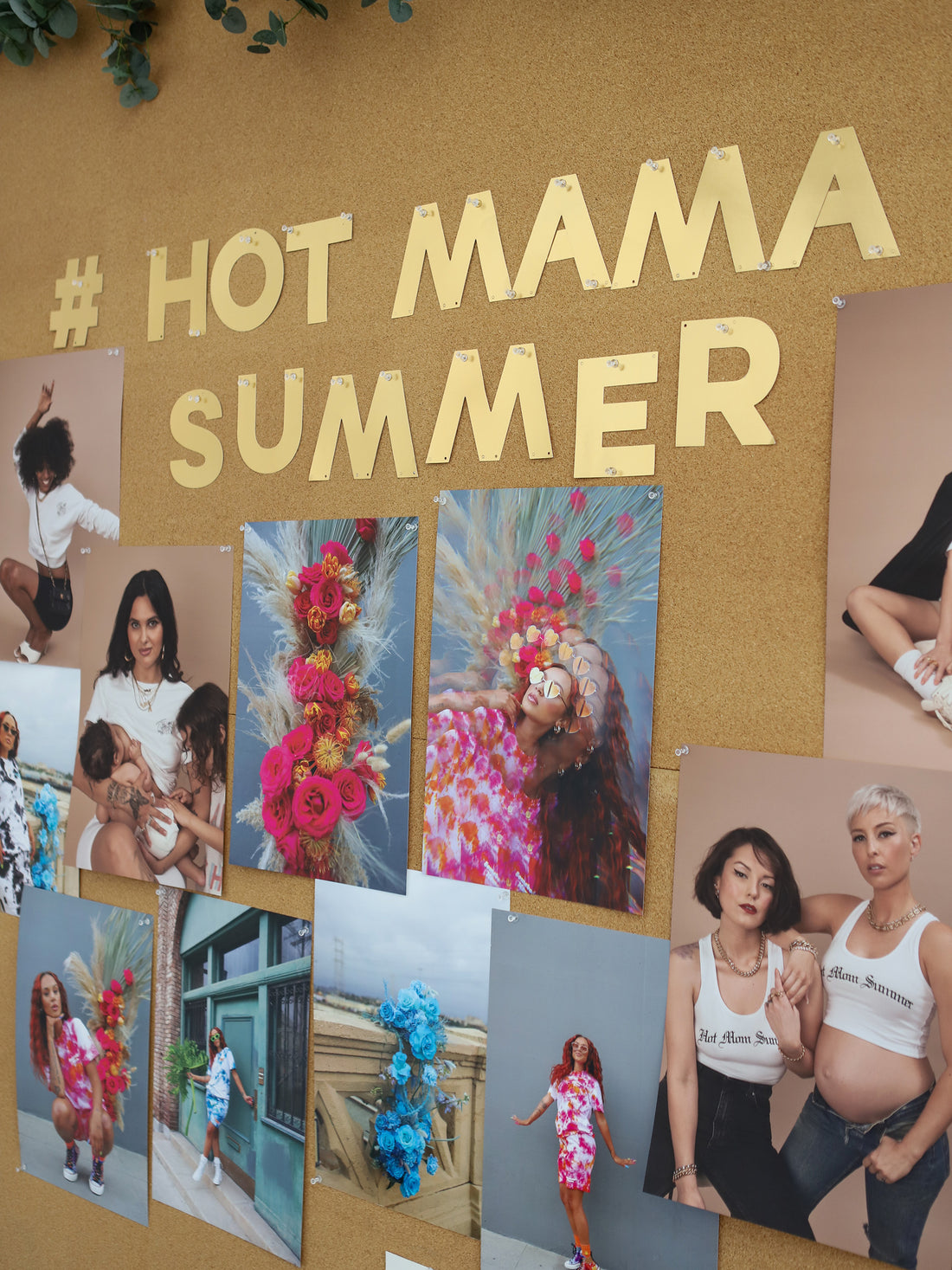A bulletin board with pictures of Moms, including one of Felicia, and #HotMamaSummer in gold letters